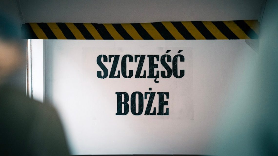 Blessings at the entrance! The phrase 'Szczęść Boże' warmly greets visitors on the wall before entering the mine, symbolizing hope and tradition tied to the miner's heritage and faith.