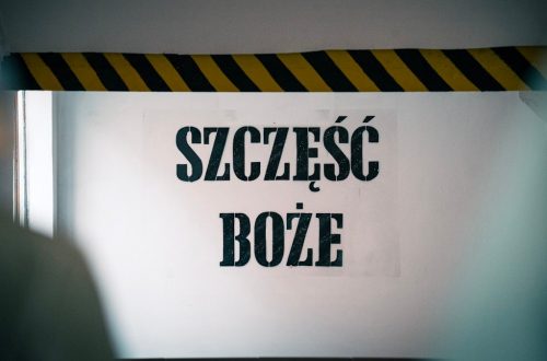 Blessings at the entrance! The phrase 'Szczęść Boże' warmly greets visitors on the wall before entering the mine, symbolizing hope and tradition tied to the miner's heritage and faith.